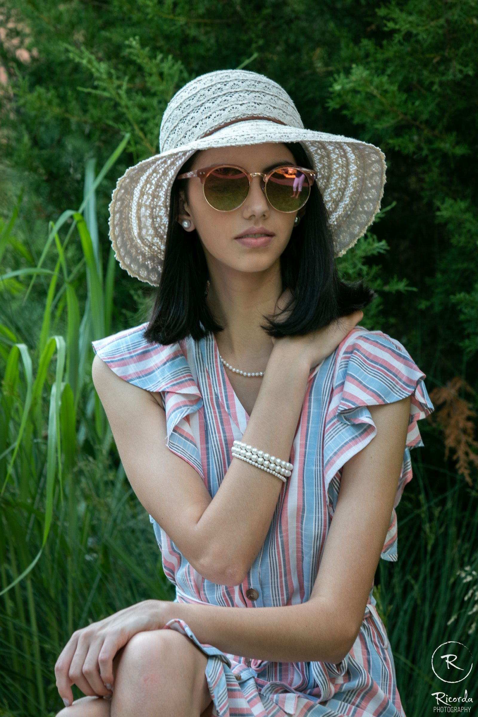 Senior portrait in a sun hat